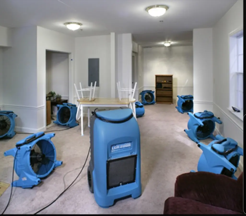 Air movers and dehumidifier setup for Water Damage Restoration in Groveton